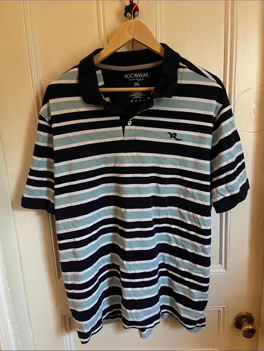 Rocawear Navy and Light Blue Striped Polo fits like a xl